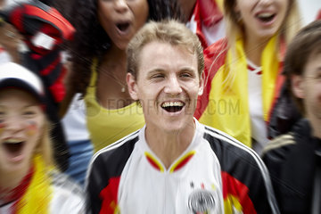 German football supporters cheering at match
