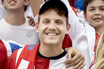 Football supporter smiling at match  portrait