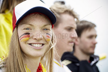 German football supporter smiling at match  portrait