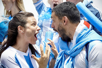 Argentinian football fans shouting excitedly at match