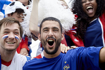 French football fans cheering at match