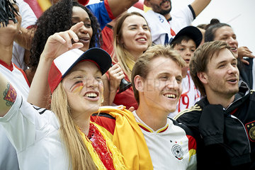 German football fans watching football match