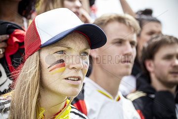 German football supporter watching attentively at match