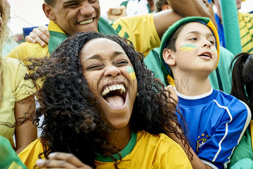 Brazilian football fans watching football match
