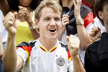 German football supporter cheering at match