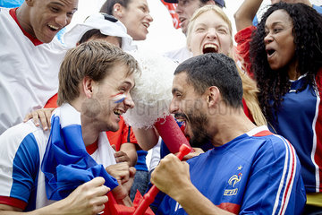 French football supporters celebrating victory at match