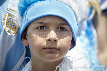 Boy supporting Argentinian football at match  portrait