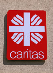 Stralsund  Deutschland  Schild der Caritas an einer Hausfassade