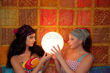 Freiburg  Deutschland  zwei Frauen mit einer Leuchtkugel