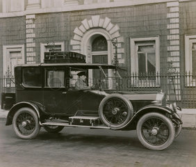 6 cylinder Cunard saloon with chauffeur and luggage on roof rack