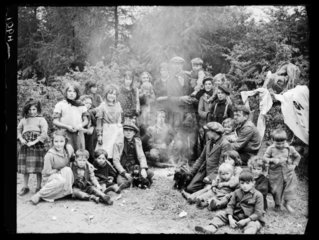 Romany group around a camp fire on Epsom Downs  Surrey  18 May 1939.