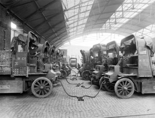 Lorries being refuelled at St Pancras goods depot  London  11 July 1917.