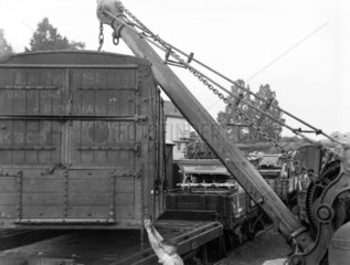 Removal van being loaded onto a train  1937.