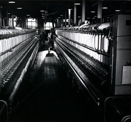 A female mill worker tends spinning mill Bolton  1956.