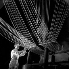 Terylene process worker with thread pattern  ICI Billingham  1955.