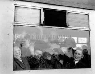Pupils in the train waving through the window  June 1955.
