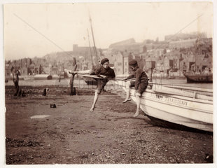 Two boys on the prow of a boat  Whitby  c 1905.