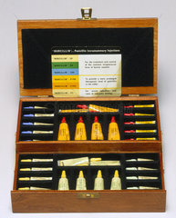 Tubes of penicillin in wooden case  c 1950s.