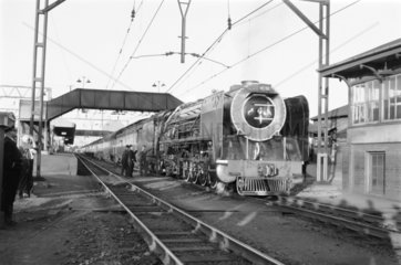Steam locomotive and passenger train  Kroonstad Station  South Africa  1968.