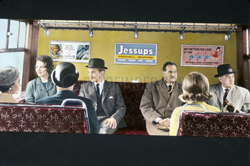 Passengers travelling in British Rail carriage in or near London  1965.