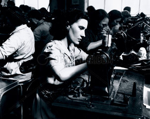Woman manufacturing shoes  1950.