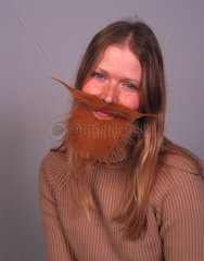 Woman wearing a fake beard  December 2000.