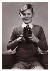 Boy with box camera  c 1930s.
