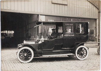 Motor car parked outside a garage  Manchester  c 1912.