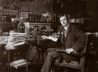 C S Rolls sitting at his desk  c 1902.