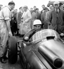 Stirling Moss in a Maserati  Italy  May 1955.