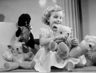 Little girl with a teddy bear  1949.