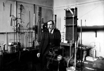 Sir William Ramsay standing in his laboratory  c 1900.