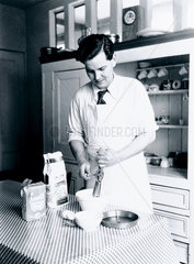 Man making a sponge cake  1937.