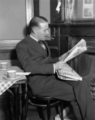 Man smoking a cigar  23 April 1931.