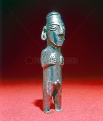 Silver male deity statue  Peruvian.