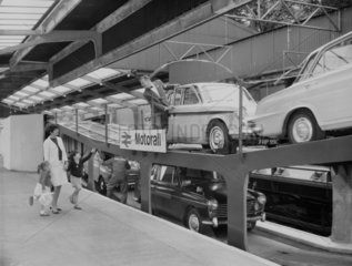 Passengers at a Motorail terminal  c 1966.