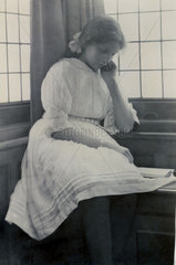 Girl reading book  1900s.