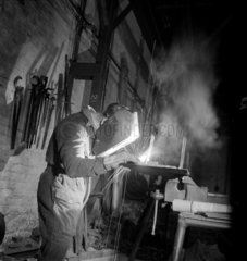 A welder works on a steel tube in a section of Talbot Stead Tubes  1948.
