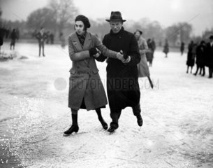 A couple ice skating  Wimbledon  London  27 January 1932.