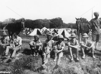 Canadian and Indian troops fraternising at