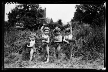 Four children in a field  1932.