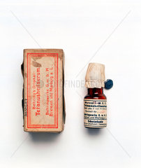 Bottle of Behring’s original tetanus serum and packet  c 1915.