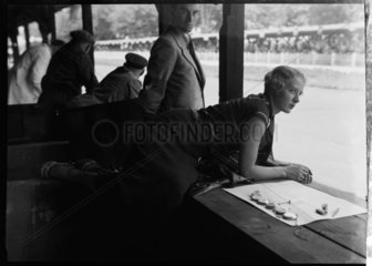 Female timekeeper at the AVUS race track  Berlin  1933.