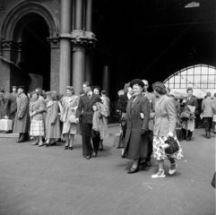 Newly arrived passengers walking from St Pancras station  London  1950.