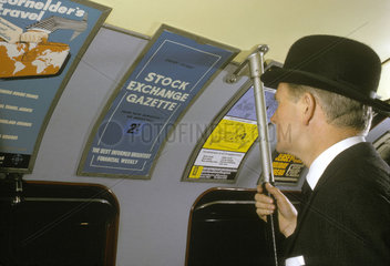 Man wearing bowler hat in carriage on Waterloo & City service  London  1965.
