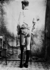 Man wearing an artificial leg  1890-1910.