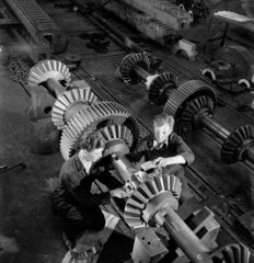 Two engineers work on large crankshaft  1953.