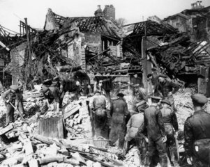Searching the wreckage of houses for victims  Second World War  c 1942.