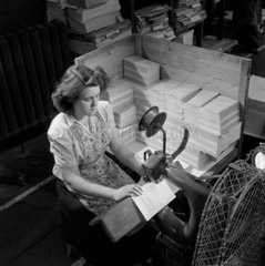 Female worker stitching pamphlets  1954.
