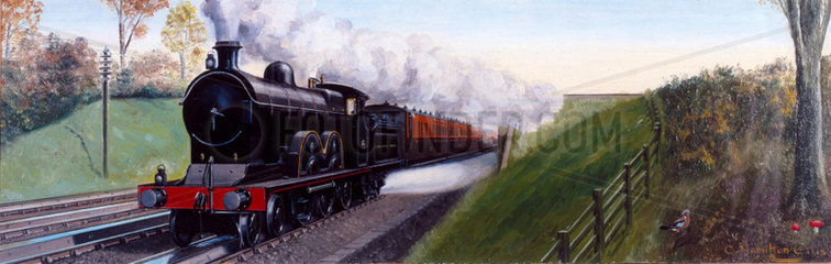 Lancashire & Yorkshire Railway express train picking up water  1900.